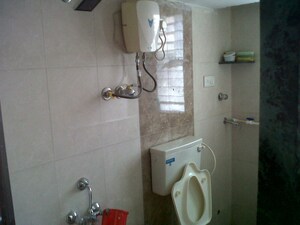 Bathroom in 1 BHK Apartment at Kings Anand Dham, Nahur East – for Rent