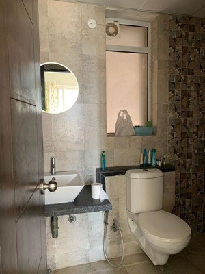 Bathroom in 2.5 BHK Apartment at Mahagun Mirabella, Sector 79 – for Sale