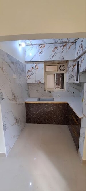 Kitchen in 2 BHK Apartment at Arun Vihar Sector 37, Sector 37 – for Sale