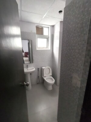 Bathroom in 3 BHK Apartment at Urban Axis Urban Woods, Sushant Golf City – for Rent