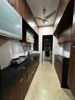 Kitchen in 2 BHK Apartment at Riddhi Gardens CHS, Malad East – for Rent