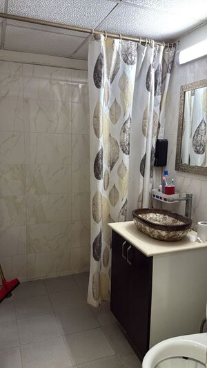 Bathroom in 3 BHK Apartment at Aims Golf City, Sector 75 – for Rent