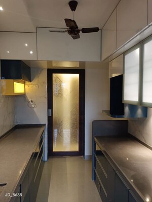 Kitchen in 2 BHK Apartment at Hubtown Greenwoods, Vartak Nagar – for Sale