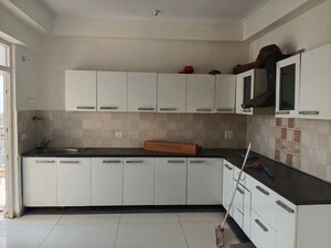 Kitchen in 4 BHK Apartment at Mahagun Mywoods, Sector 16c Greater Noida – for Rent