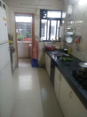 Kitchen in 2 BHK Apartment at Sunshree Woods, Nibm Road – for Rent