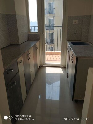 Kitchen in 2 BHK Apartment at Fusion Ufairia, Sector 16b Greater Noida – for Rent