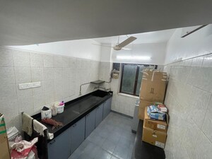 Kitchen in 2 BHK Apartment at Anand Milan Society, Santacruz West – for Rent