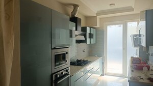 Kitchen in 4 BHK Apartment at Ansal API Esencia, Sector 67 – for Rent