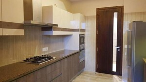 Kitchen in 3.5 BHK Apartment at Ambience Creacions, Sector 22 – for Sale