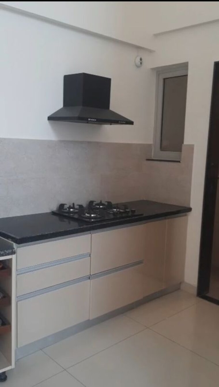 Kitchen, gera-planet-of-joy 2 Bedroom 773 Sq.Ft. Apartment In Kharadi Pune 10296474