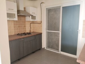 Kitchen in 2.5 BHK Apartment at Mahagun Moderne, Sector 78 – for Sale
