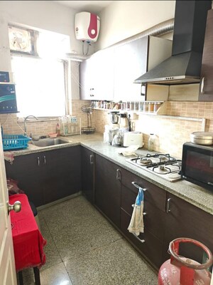Kitchen in 2 BHK Apartment at Raheja Vedaanta, Sector 108 – for Rent