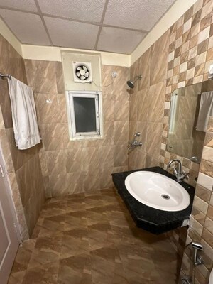 Bathroom in 3.5 BHK Apartment at Ansal Celebrity Meadows, Sushant Golf City – for Rent