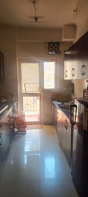 Kitchen in 3 BHK Apartment at Aims Golf Avenue I, Sector 75 – for Rent