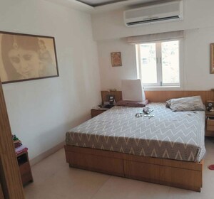 Bedroom in 2 BHK Apartment at Hanuman Sharan CHS, Cumbala Hill – for Sale