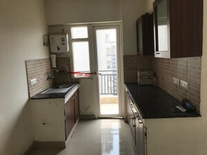 Kitchen in 3 BHK Apartment at Amrapali Royal, Vaibhav Khand – for Rent