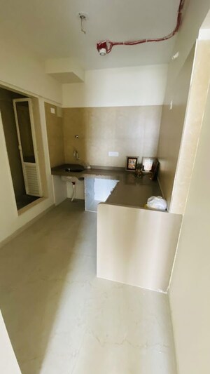 Kitchen in 2 BHK Apartment at Dosti West County, Balkum Pada – for Rent