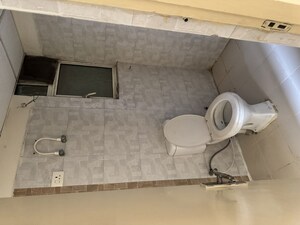 Bathroom in 2 BHK Apartment at Grah Avas Green View Heights, Raj Nagar Extension – for Rent