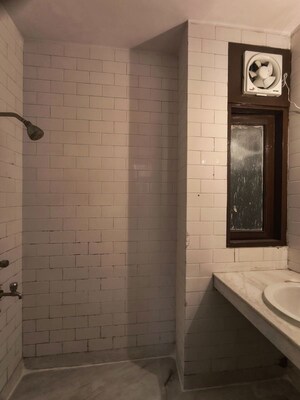 Bathroom in 3 BHK Apartment at Chittaranjan Park – for Rent