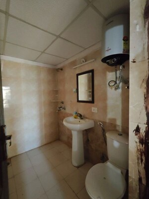 Bathroom in 3.5 BHK Apartment at Aims Golf City, Sector 75 – for Rent