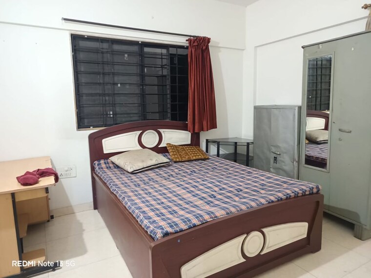 Bedroom, magarpatta-city-cosmos 2 Bedroom 1000 Sq.Ft. Apartment In Magarpatta Road Pune 10302016