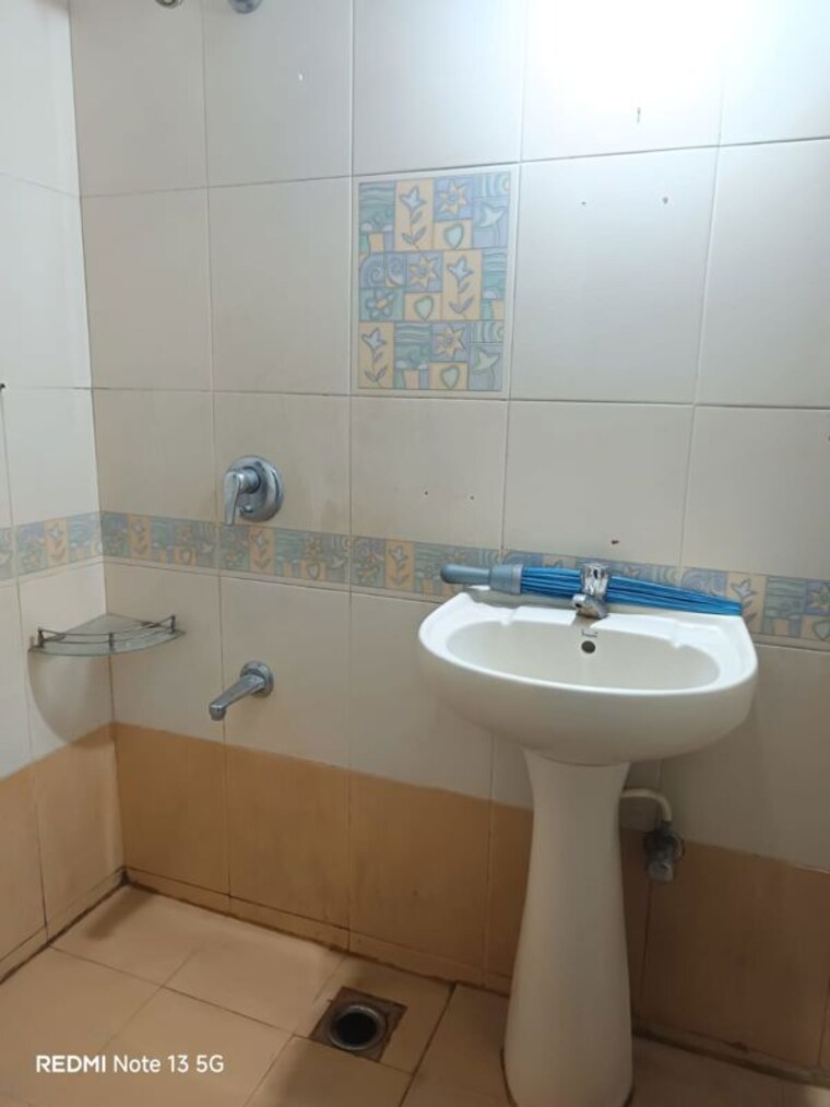 Bathroom, magarpatta-city-cosmos 2 Bedroom 1000 Sq.Ft. Apartment In Magarpatta Road Pune 10302016