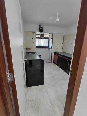 Kitchen in 3 BHK Apartment at Sita Sadan CHS, Borivali West – for Sale