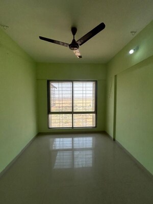 Room in 2 BHK Apartment at Kamdhenu 7th Heaven, Dhanori – for Rent