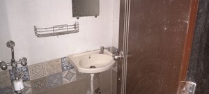 Bathroom in 3 BHK Apartment at Kanchan Nalanda CHS, Malad West – for Rent