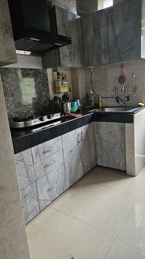 Kitchen in 3 BHK Apartment at Amrapali Heartbeat City, Sector 107 – for Rent