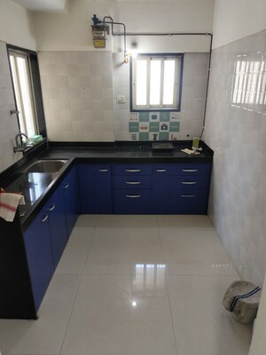 Kitchen in 1 BHK Apartment at Rosa Royale, Ghodbunder Road – for Rent