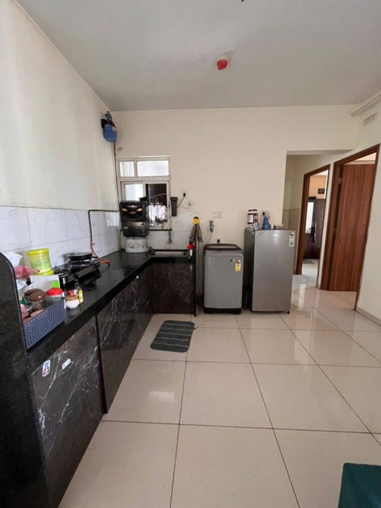 Kitchen, kolte-patil-life-republic-oro-avenue 2 Bedroom 659 Sq.Ft. Apartment In Hinjewadi Pune 10303896