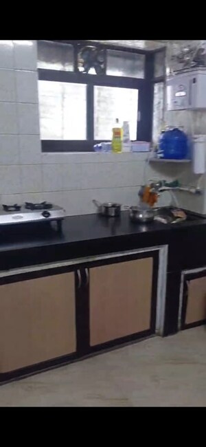 Kitchen in 2 BHK Apartment at Milap CHS, Andheri West – for Rent