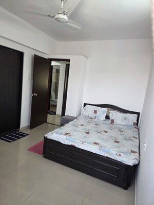 Bedroom in 2 BHK Apartment at Satyam Serenity, Wadgaon Sheri – for Rent