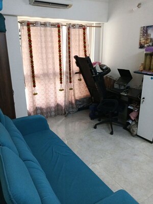 Living Room in 1 BHK Apartment at Lodha Amara, Kolshet Road – for Sale
