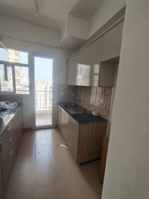 Kitchen in 3.5 BHK Apartment at Amrapali Crystal Homes, Sector 76 – for Rent