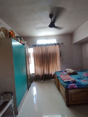 Living Room in 2 BHK Apartment at Garden Court, Waghbil – for Sale