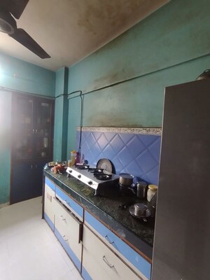 Kitchen in 2 BHK Apartment at Garden Court, Waghbil – for Sale