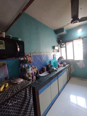 Kitchen in 2 BHK Apartment at Garden Court, Waghbil – for Sale