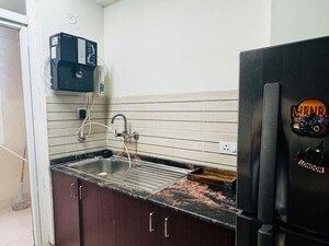 Kitchen in 2 BHK Apartment at Amrapali Platinum, Sector 119 – for Sale