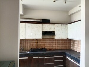 Kitchen in 3 BHK Apartment at Mahagun Mywoods, Sector 16c Greater Noida – for Rent