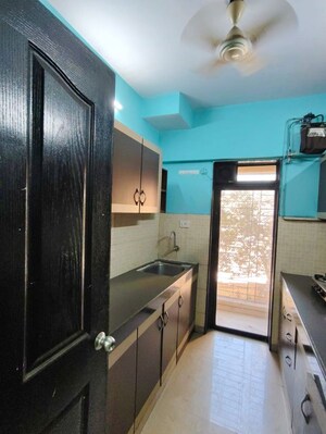 Kitchen in 2 BHK Apartment at Lalani Residency, Kavesar – for Rent