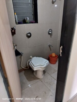 Bathroom in 3 BHK Apartment at Pranjee Garden City Phase 2, Katrap – for Rent