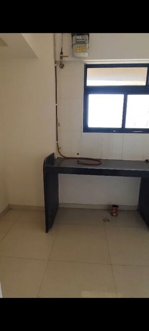 Kitchen in 1 BHK Apartment at Raunak Delight, Owale – for Rent