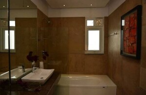 Bathroom in 3 BHK Apartment at Rishita Manhattan, Gomti Nagar – for Rent