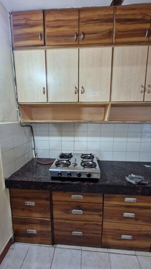 Kitchen in 2 BHK Apartment at Sadguru Dhaval CHS, Malad West – for Rent