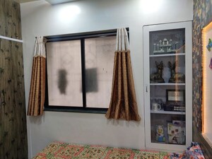 Living Room in 2 BHK Apartment at Samarth Puram CHS, Shivane – for Rent