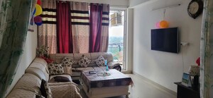 Living Room in 2.5 BHK Apartment at Mahagun Moderne, Sector 78 – for Rent