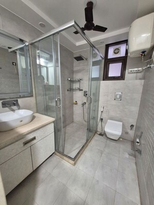 Bathroom in 4 BHK Apartment at Sarvapriya Vihar – for Rent