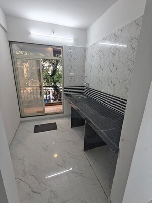 Kitchen in 2 BHK Apartment at Leena Samrat Plaza CHS, Kansai – for Sale